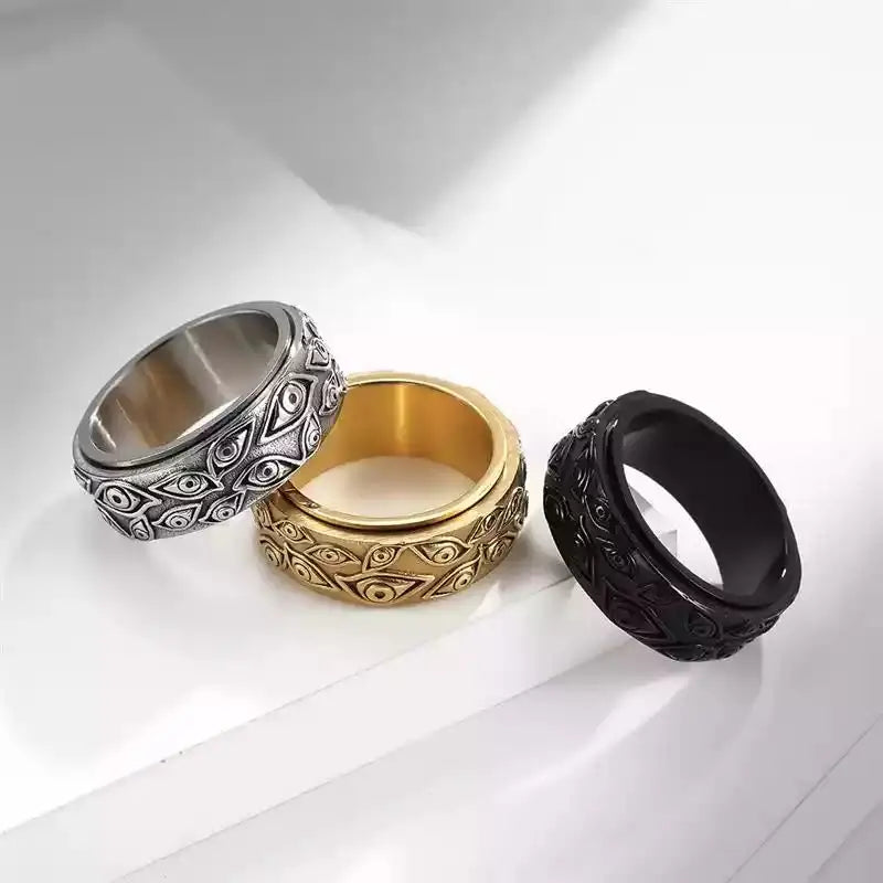 Ring featuring an eye-inspired carved design and durable stainless steel construction.