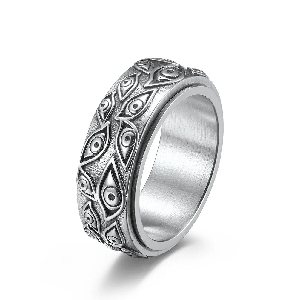 Ring featuring an eye-inspired carved design and durable stainless steel construction.