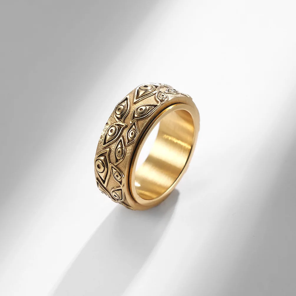 Ring featuring an eye-inspired carved design and durable stainless steel construction.