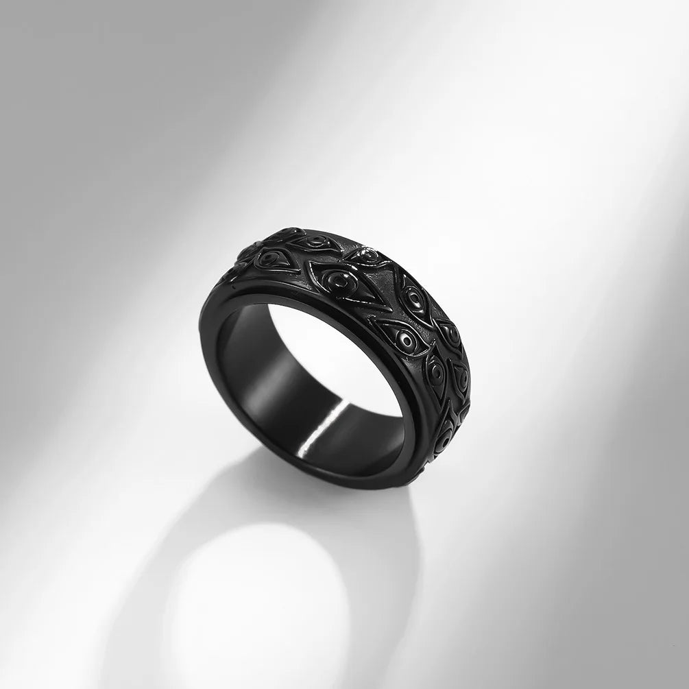 Ring featuring an eye-inspired carved design and durable stainless steel construction.