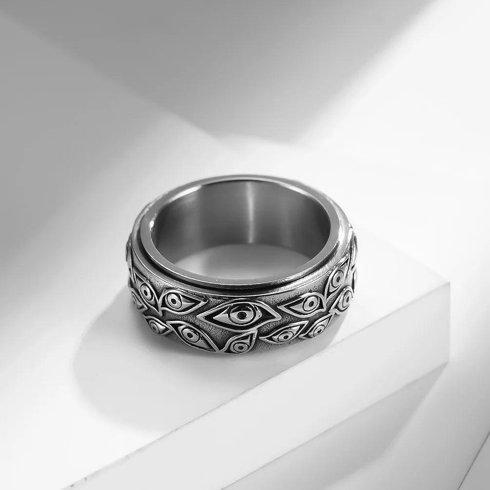 Ring featuring an eye-inspired carved design and durable stainless steel construction.