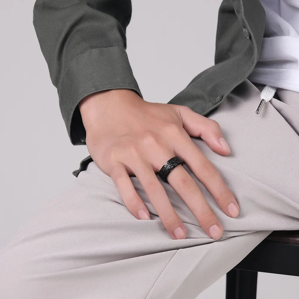 Ring featuring an eye-inspired carved design and durable stainless steel construction.