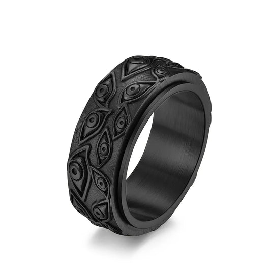 Ring featuring an eye-inspired carved design and durable stainless steel construction.
